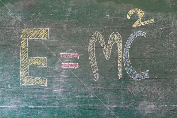 E=mc2. Theory of relativity, writings on blackboard
