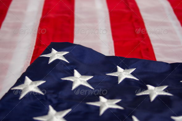 American Flag Folded Over Background