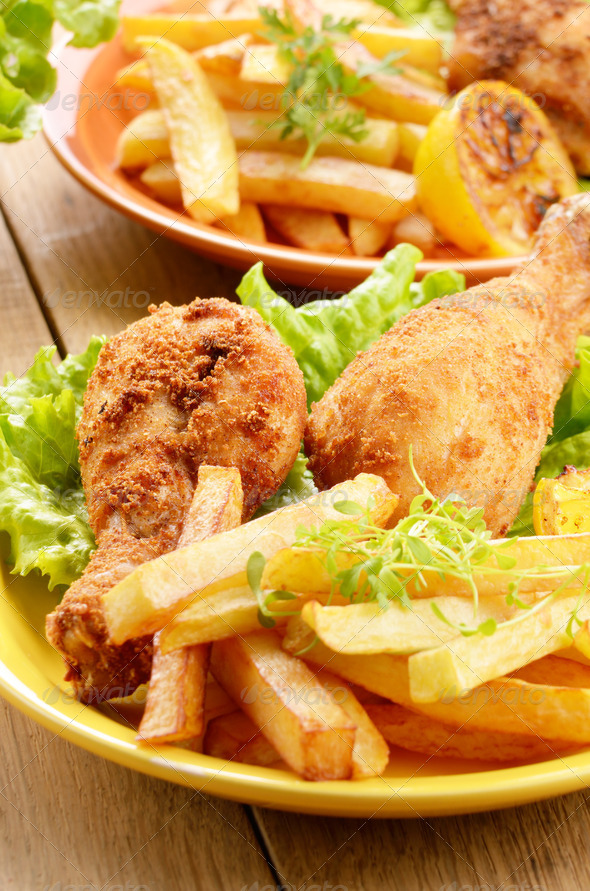 Fried drumsticks with french fries