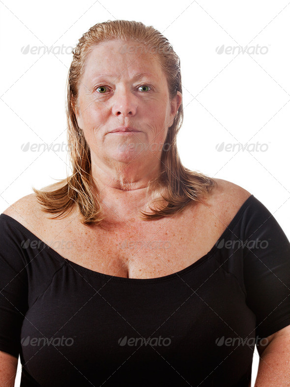 Mature woman with a completely makeup free face and wet hair