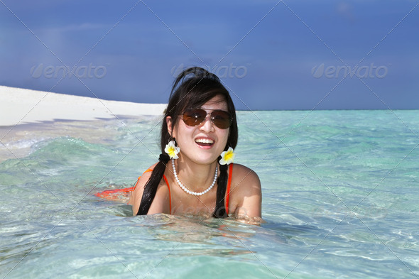 Beautiful fashion asian girl play water in sea in summer  Stock Photo 