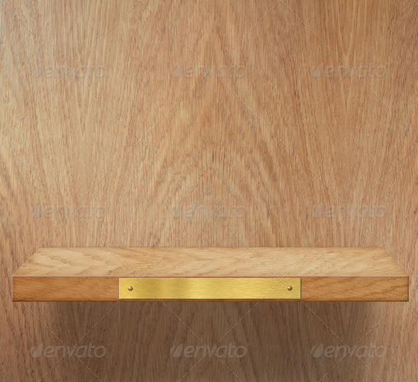 Empty wooden shelf with brass metal plate