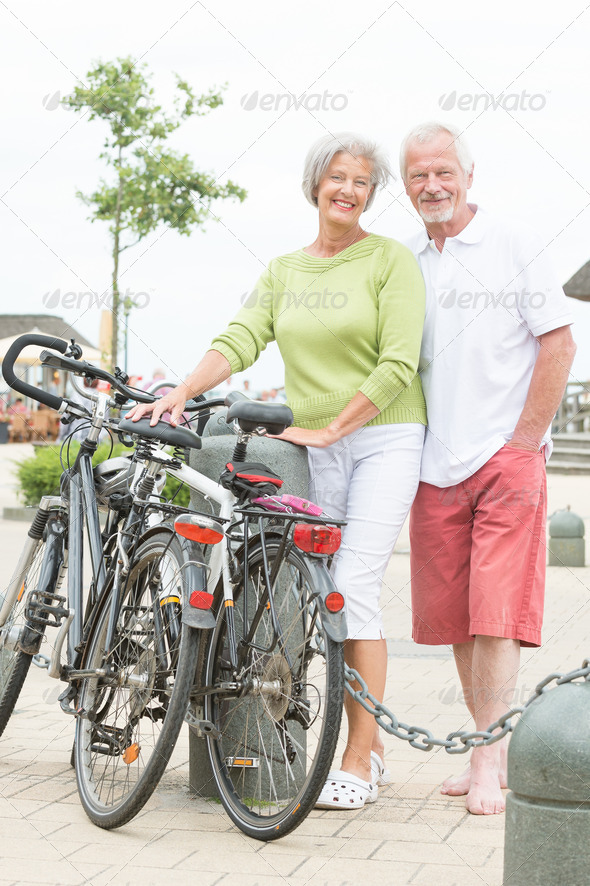 Active senior couple with bikes