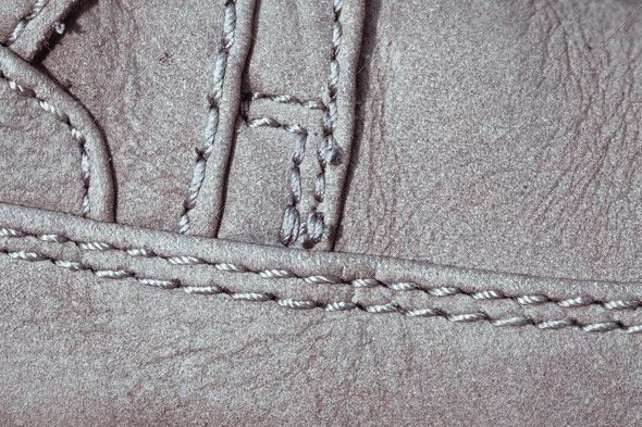 Close up of a suede shoe with details of stitching