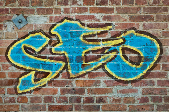 SEO – (search engine optimization acronym) graffiti style text on a old grunge brick wall