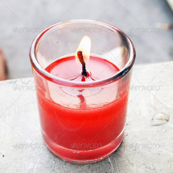 red pillar candle burning