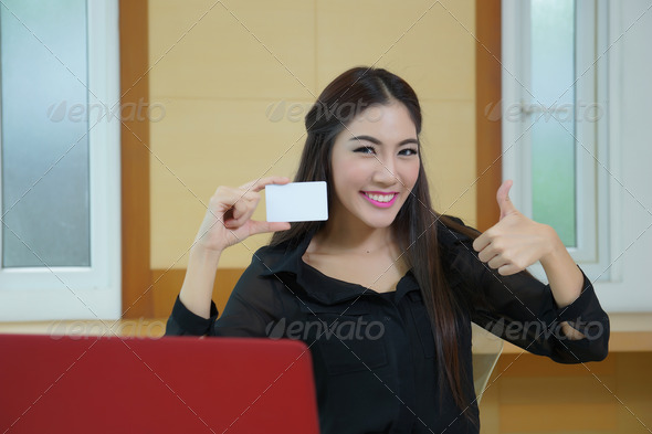 Young woman shopping on the Internet with credit card